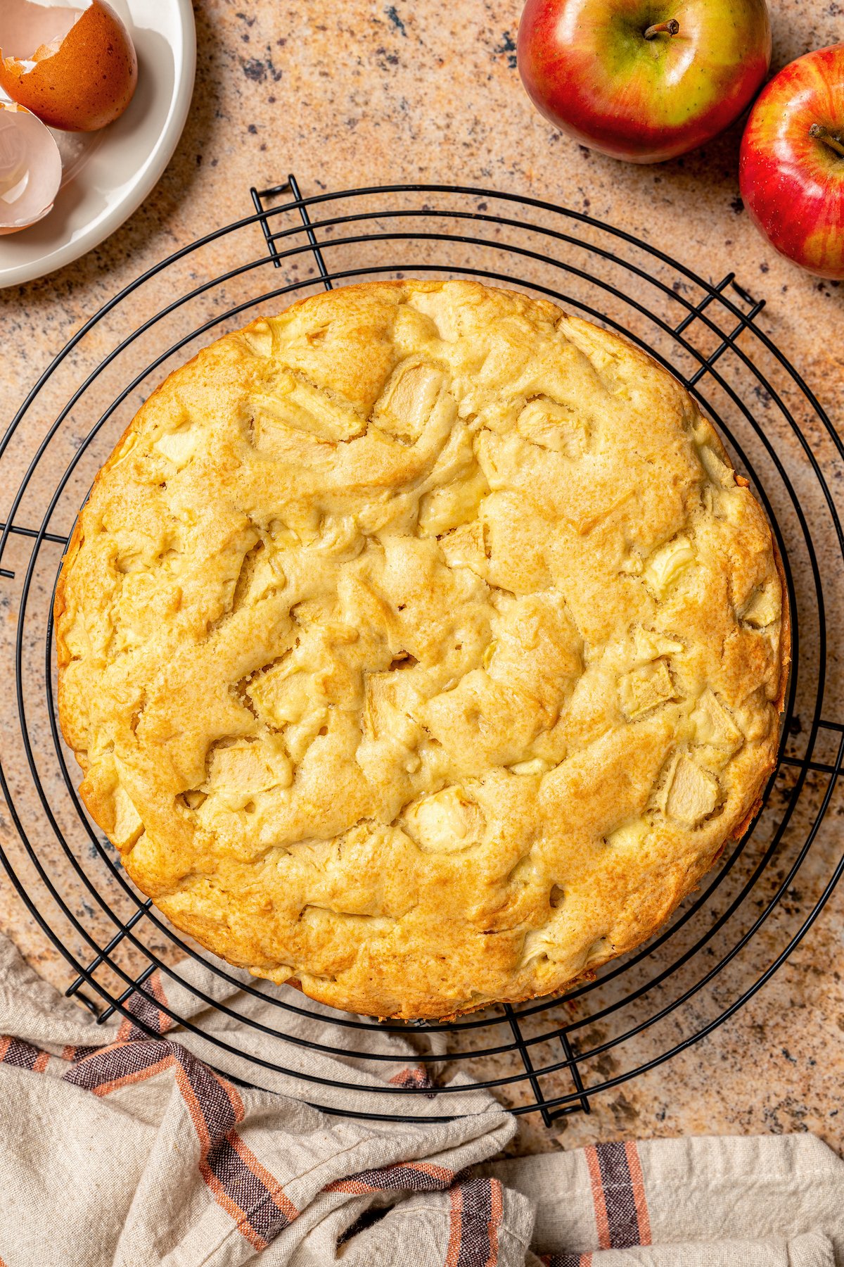 Whole, freshly-baked cake on a cooling rack. 